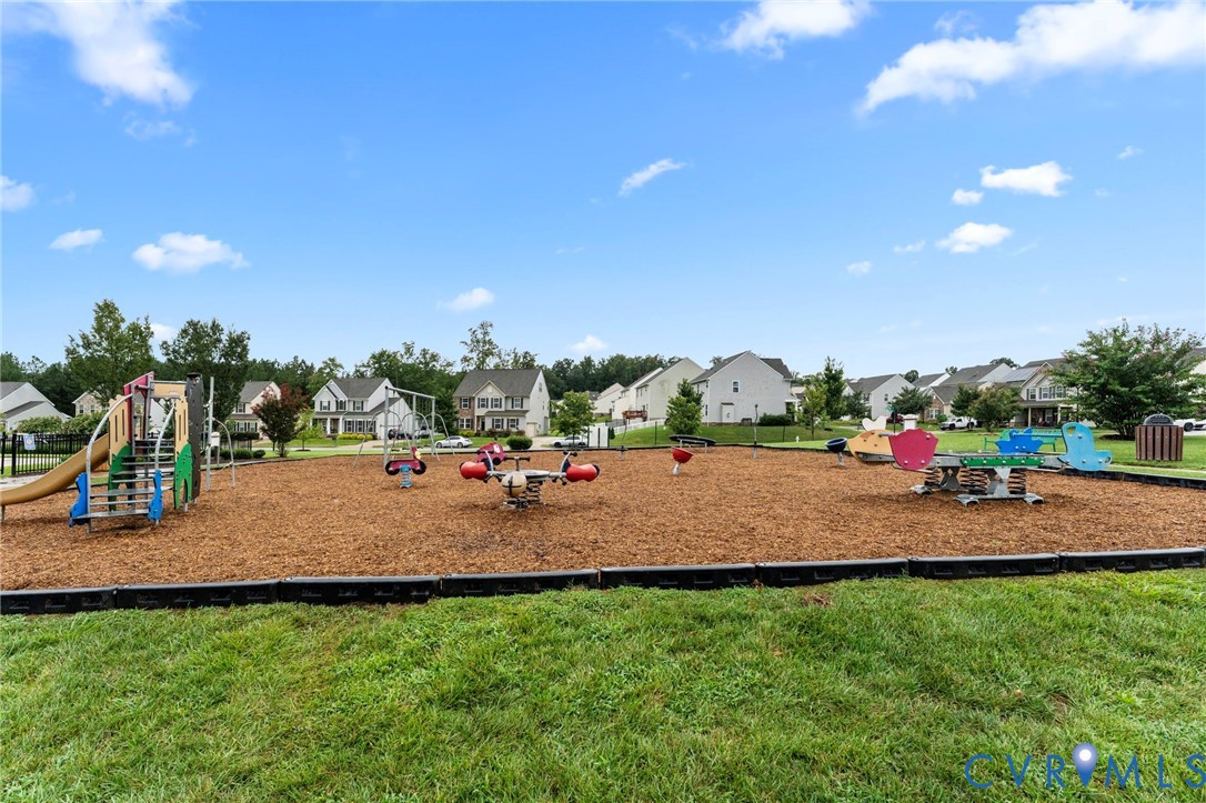 7809 Chasing Lane Richmond, VA 23237 - Photo 18 of 23 a view of outdoor space with playground and green space