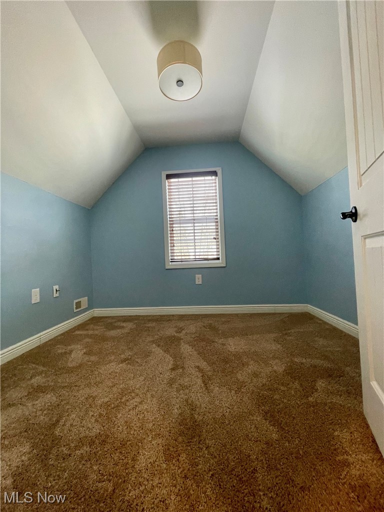 1544 Edgefield Road Lyndhurst, OH 44124 - Photo 24 of 36 Additional living space with dark carpet and lofted ceiling
