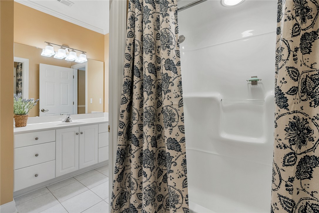 200 Graylyn Drive Anderson, SC 29621 - Photo 25 of 48 A well-appointed bathroom features a bright vanity with ample storage and a practical shower.