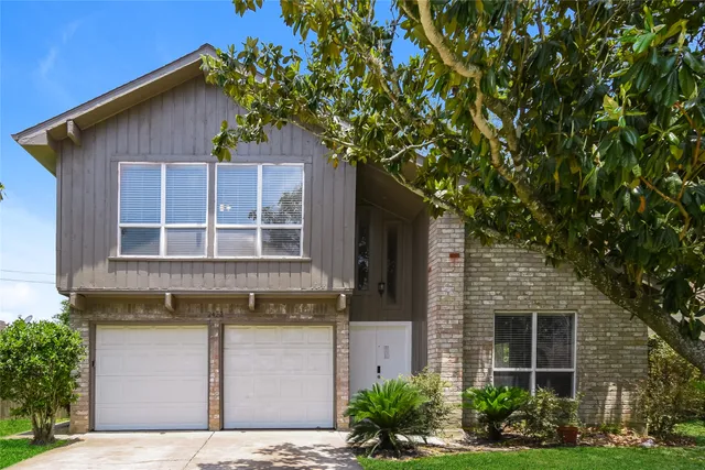 a house view with a garden space