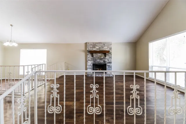 a view of an empty room with windows