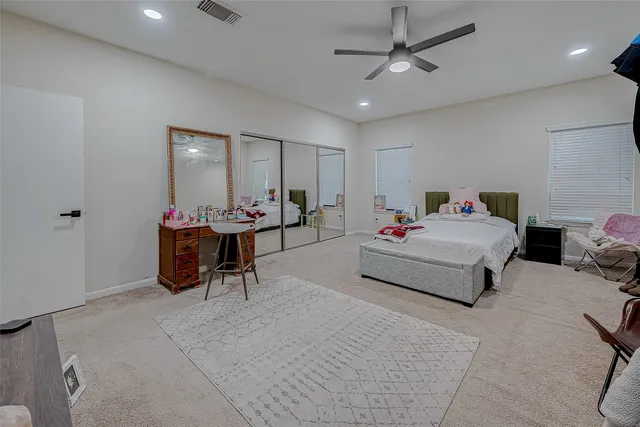 a bedroom with furniture and a chandelier