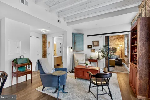 a living room with furniture and a table