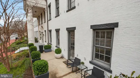 a view of backyard with patio