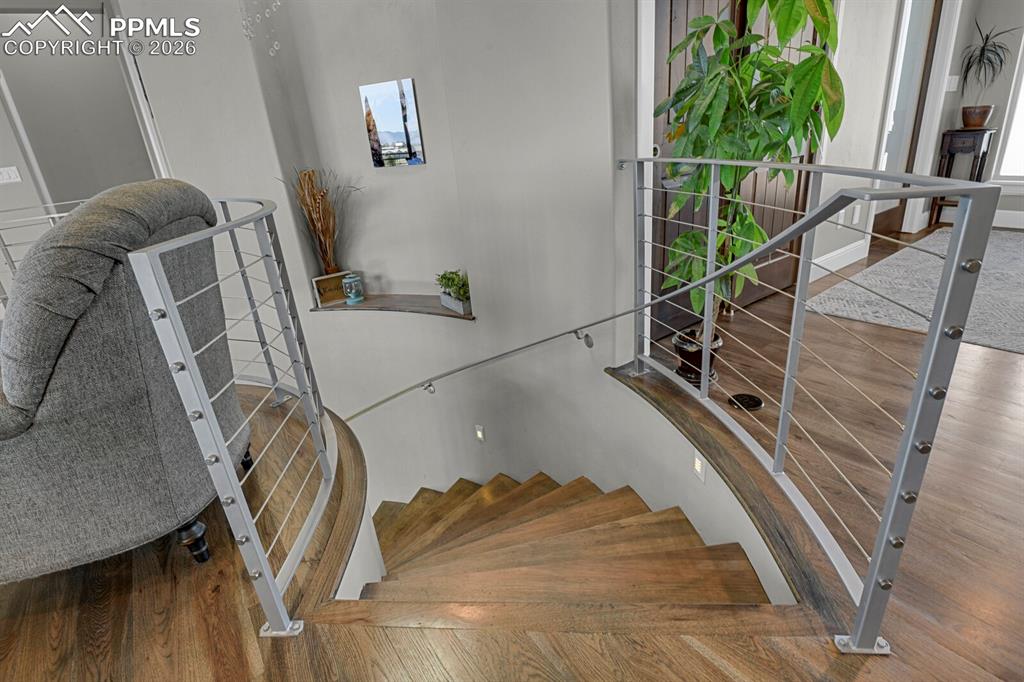 4824 Settlers Ranch Road Colorado Springs, CO 80908 - Photo 4 of 43 Curved Hickory staircase