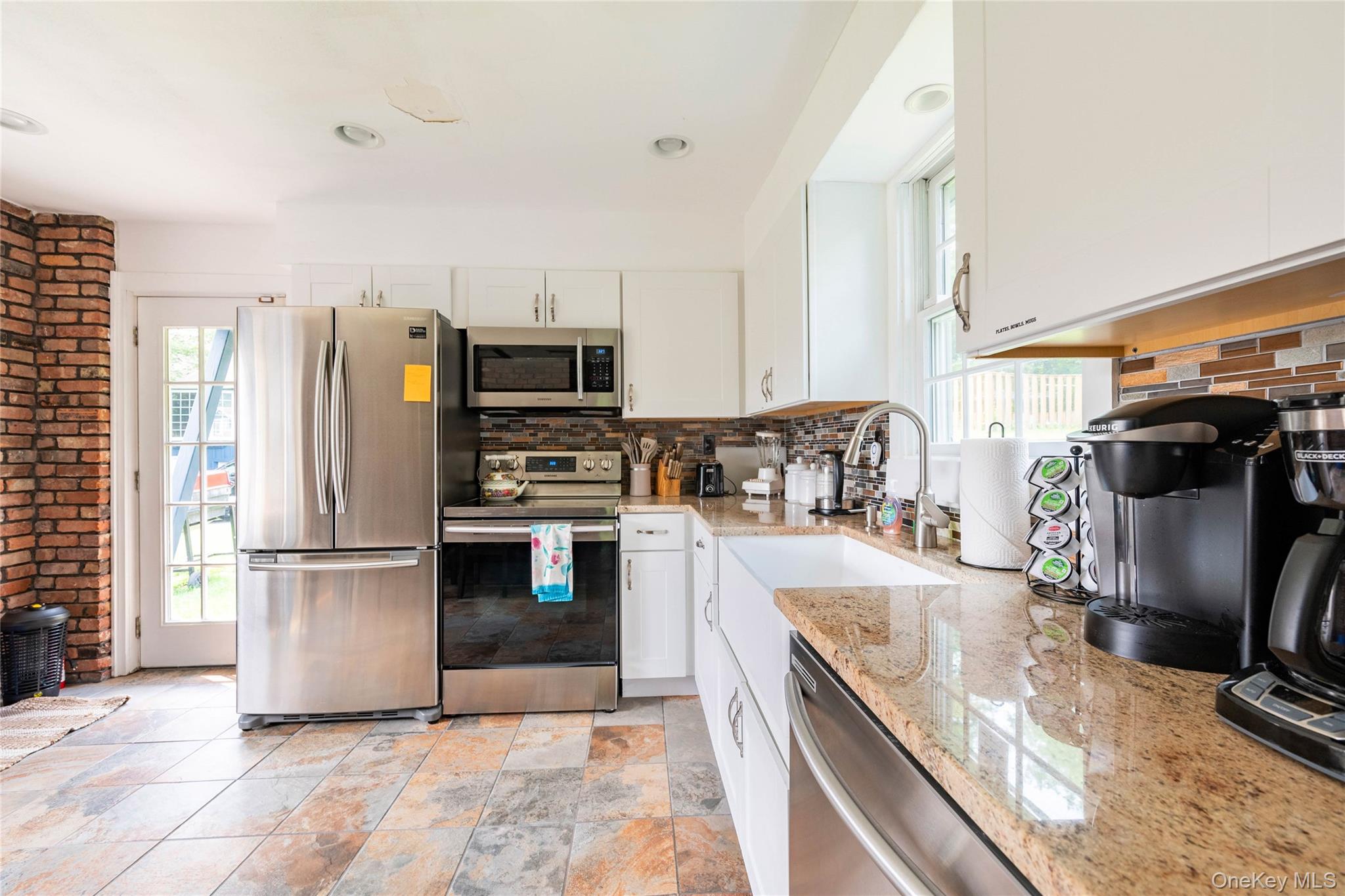 670 Creamery Road Mongaup Valley, NY 12762 - Photo 25 of 47 a kitchen with stainless steel appliances granite countertop a stove refrigerator and a sink