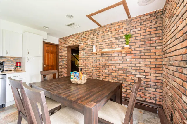 a utility room with cabinets washer and dryer