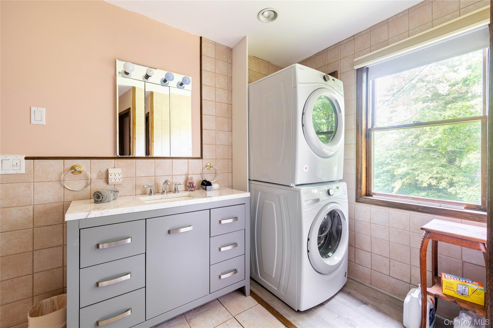 670 Creamery Road Mongaup Valley, NY 12762 - Photo 32 of 47 a bathroom with a sink a washer and dryer next to a window