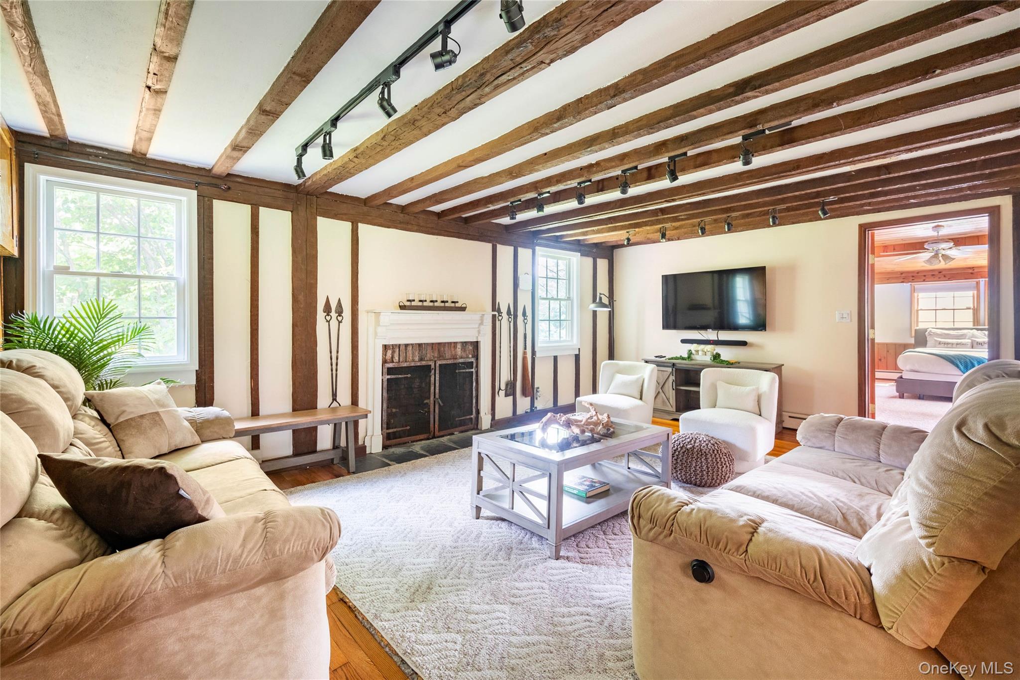 670 Creamery Road Mongaup Valley, NY 12762 - Photo 36 of 47 a living room with furniture a fireplace and a large window
