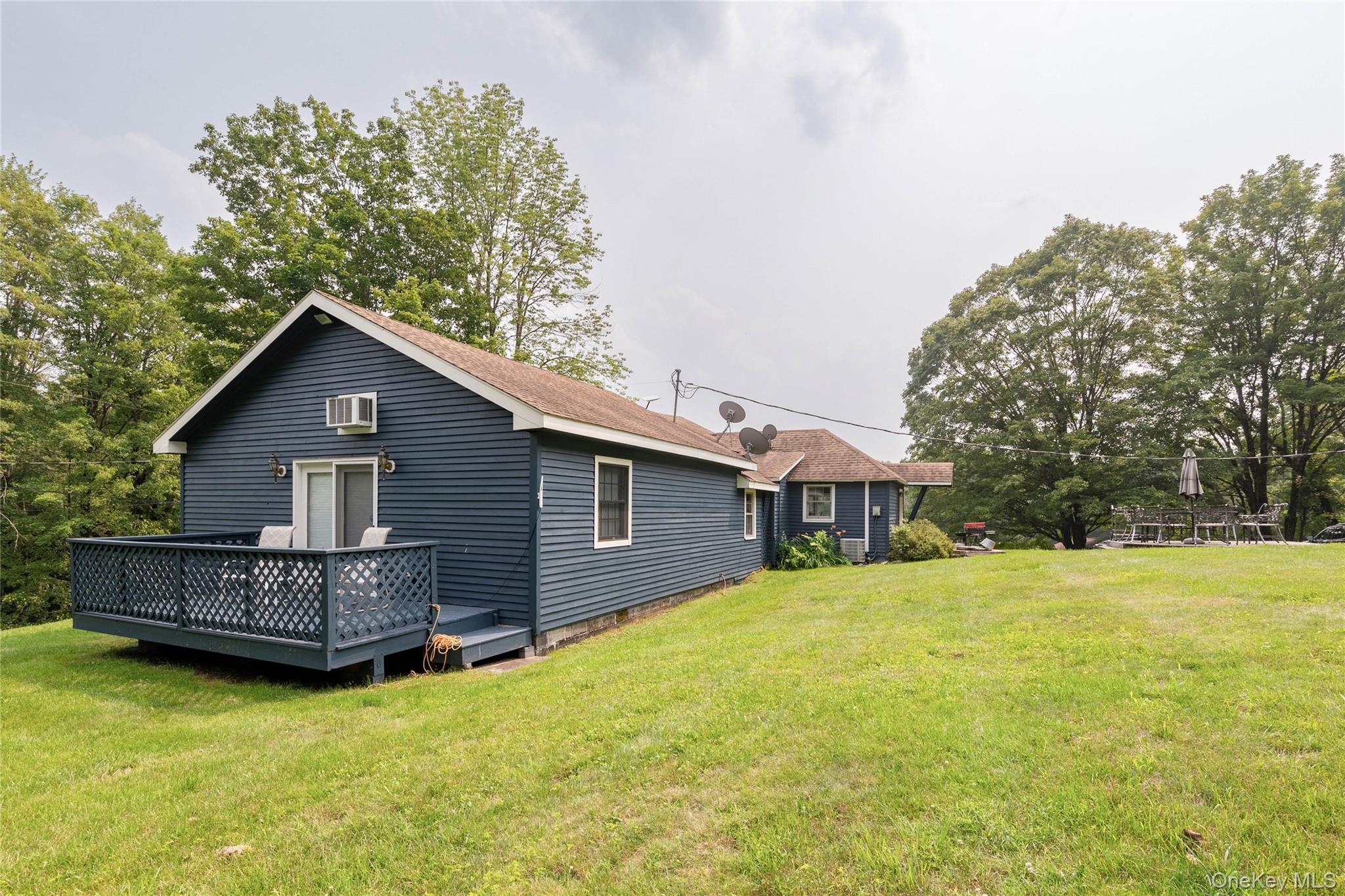 670 Creamery Road Mongaup Valley, NY 12762 - Photo 40 of 47 a view of a house with a yard and wooden fence