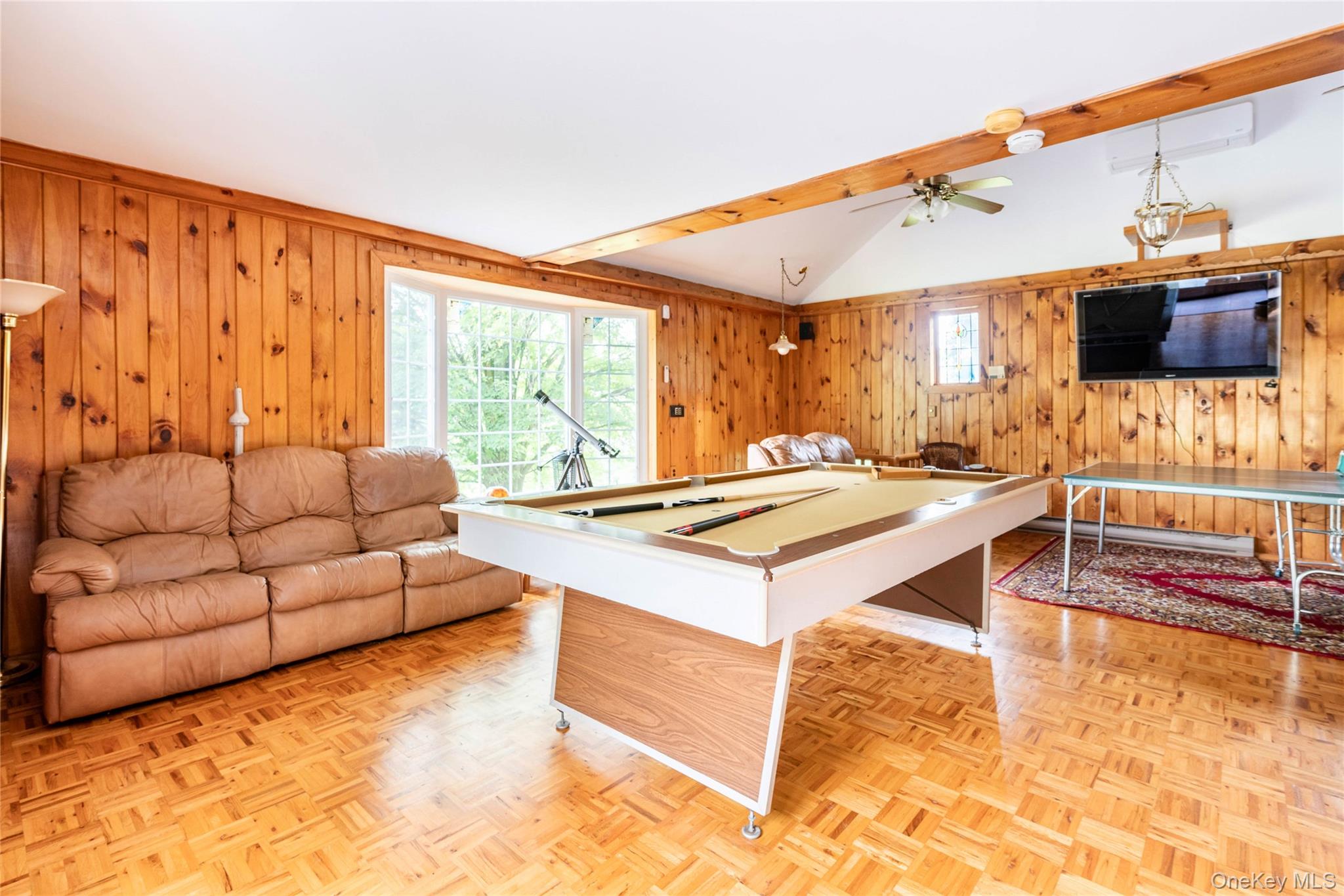 670 Creamery Road Mongaup Valley, NY 12762 - Photo 8 of 47 a living room with furniture and a flat screen tv