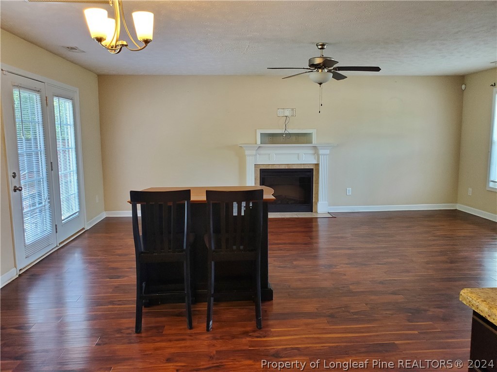 2713 Rockfish Road Raeford, NC 28376 - Photo 6 of 29 a view of a livingroom with furniture wooden floor fireplace and a window