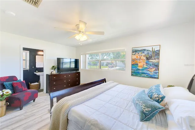 a bedroom with a bed and a couch