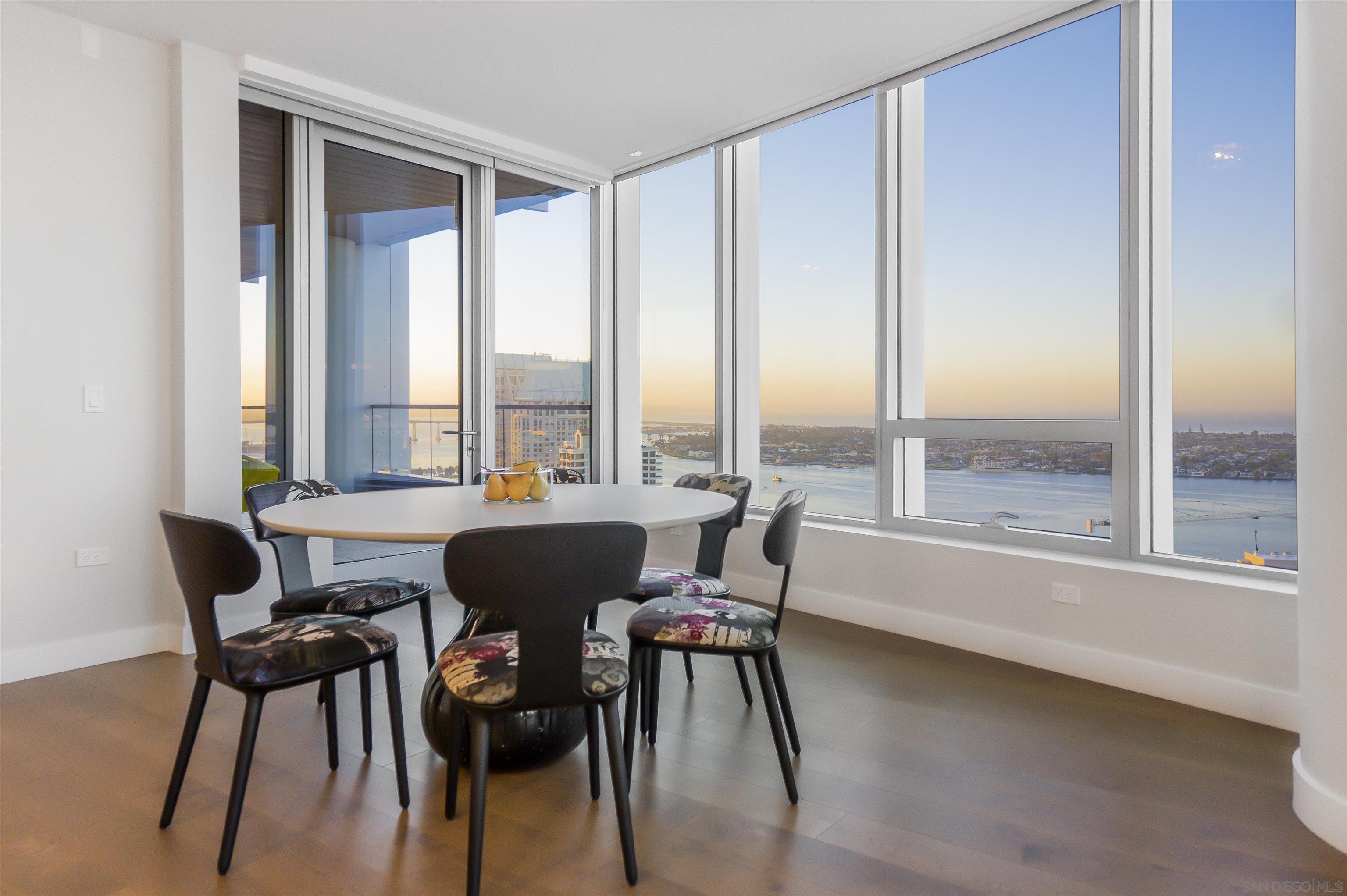 888 E Street, Unit 3602 San Diego, CA 92101 - Photo 11 of 51 a dining room with furniture and large windows