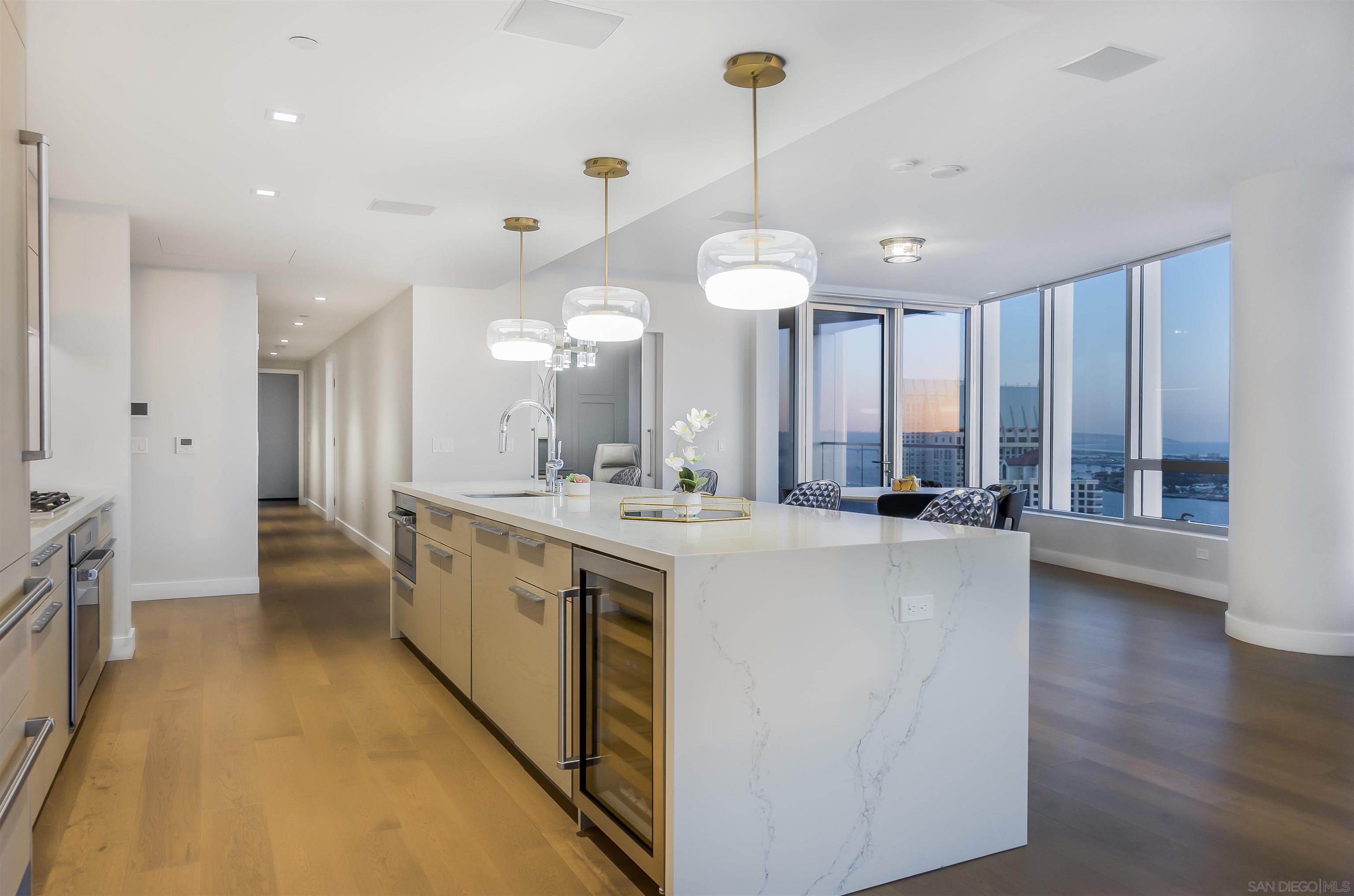 888 E Street, Unit 3602 San Diego, CA 92101 - Photo 14 of 51 a large white kitchen with a large window