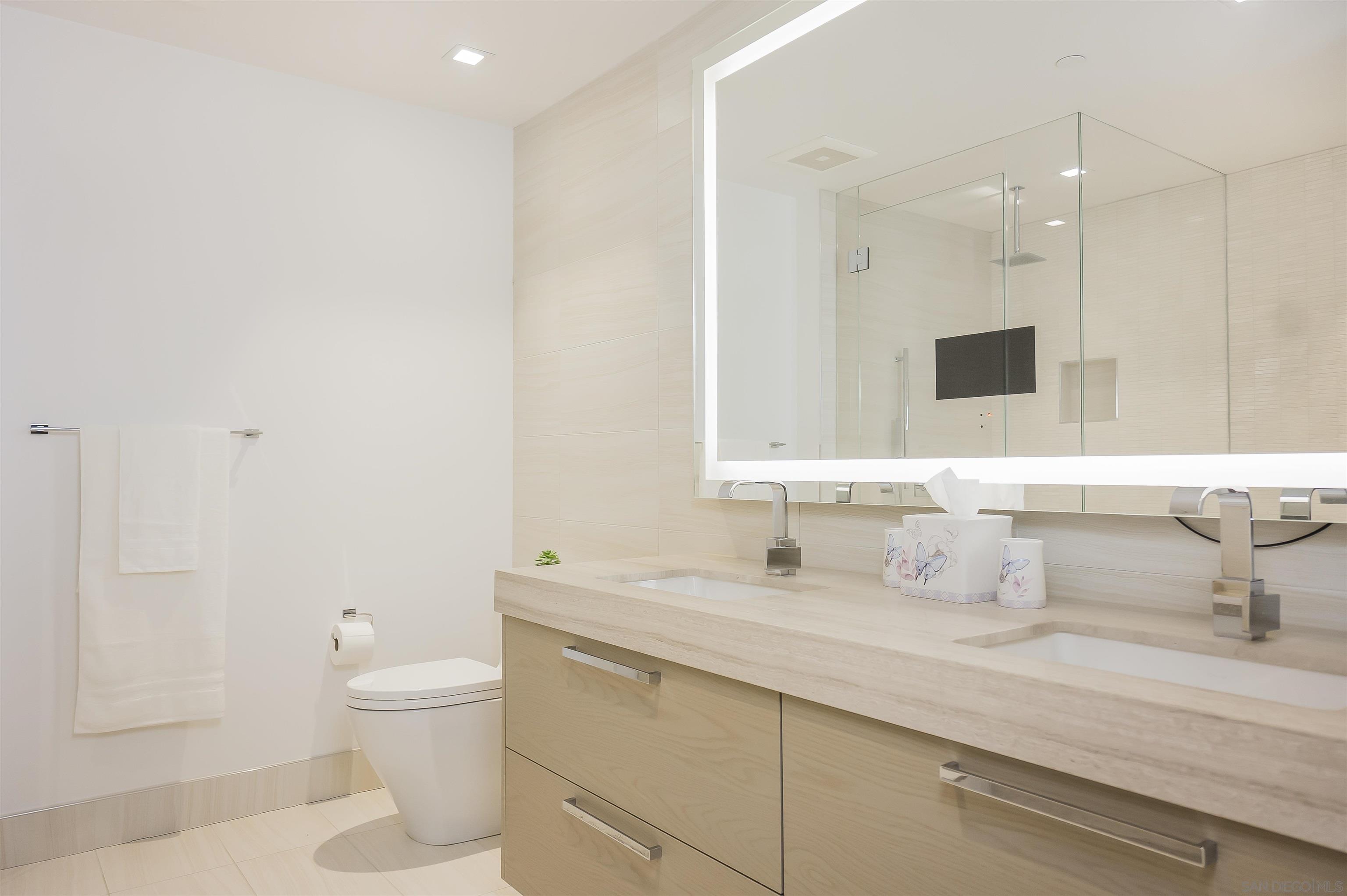888 E Street, Unit 3602 San Diego, CA 92101 - Photo 23 of 51 a bathroom with a sink and a mirror