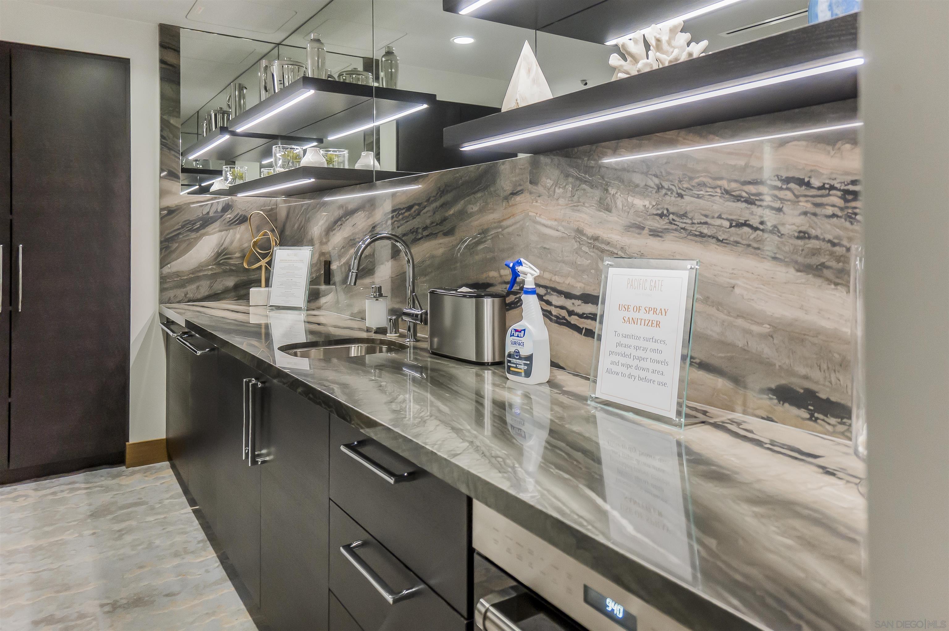 888 E Street, Unit 3602 San Diego, CA 92101 - Photo 33 of 51 a kitchen with a sink and a refrigerator