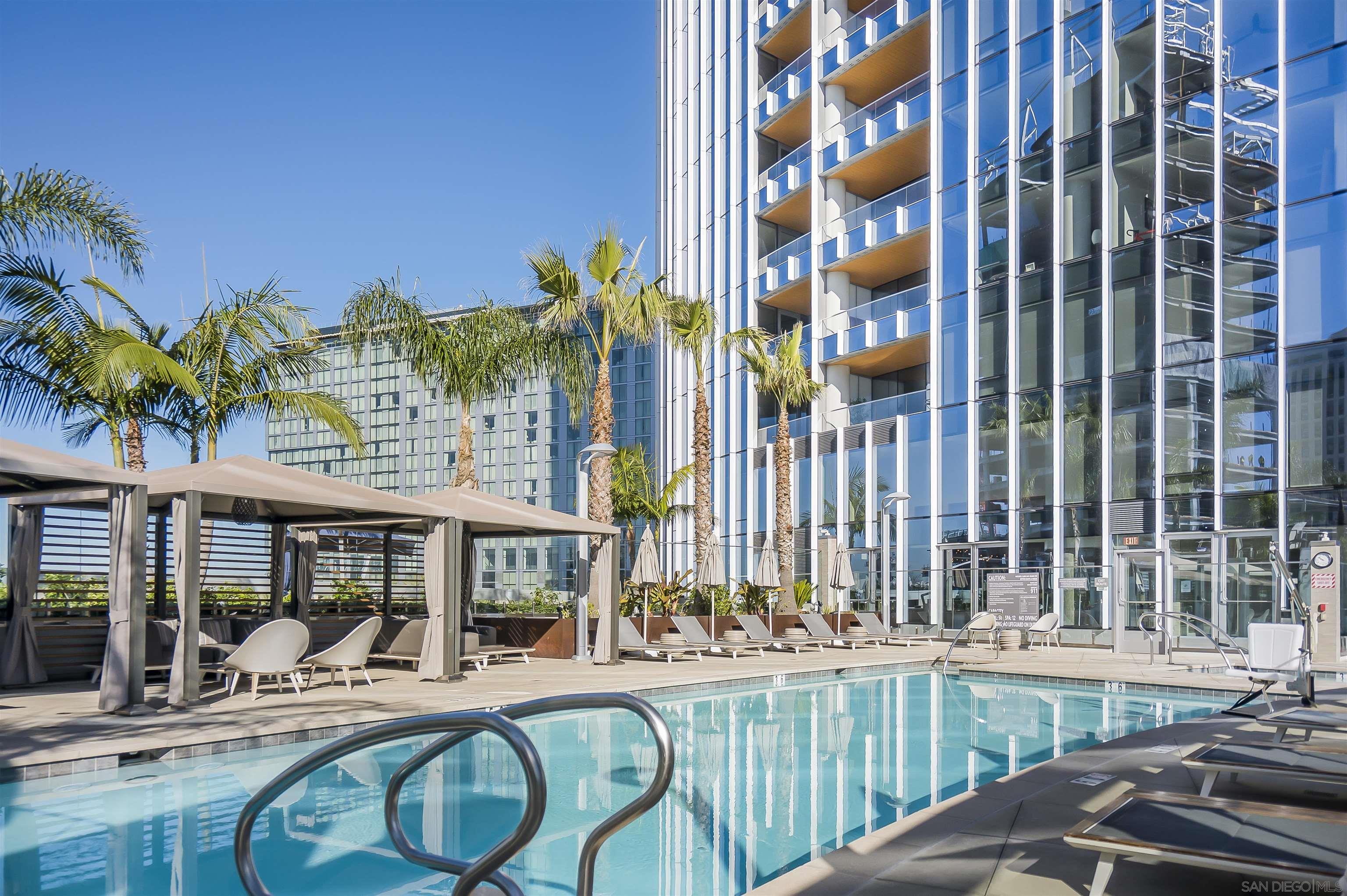 888 E Street, Unit 3602 San Diego, CA 92101 - Photo 44 of 51 a view of a patio with swimming pool table and chairs