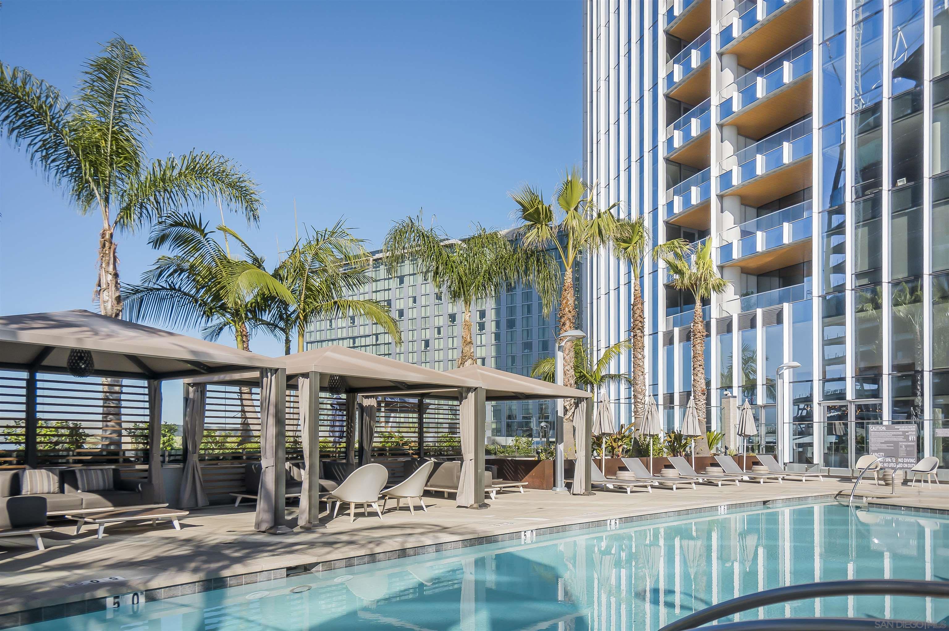 888 E Street, Unit 3602 San Diego, CA 92101 - Photo 45 of 51 front view of a building with a garden and patio
