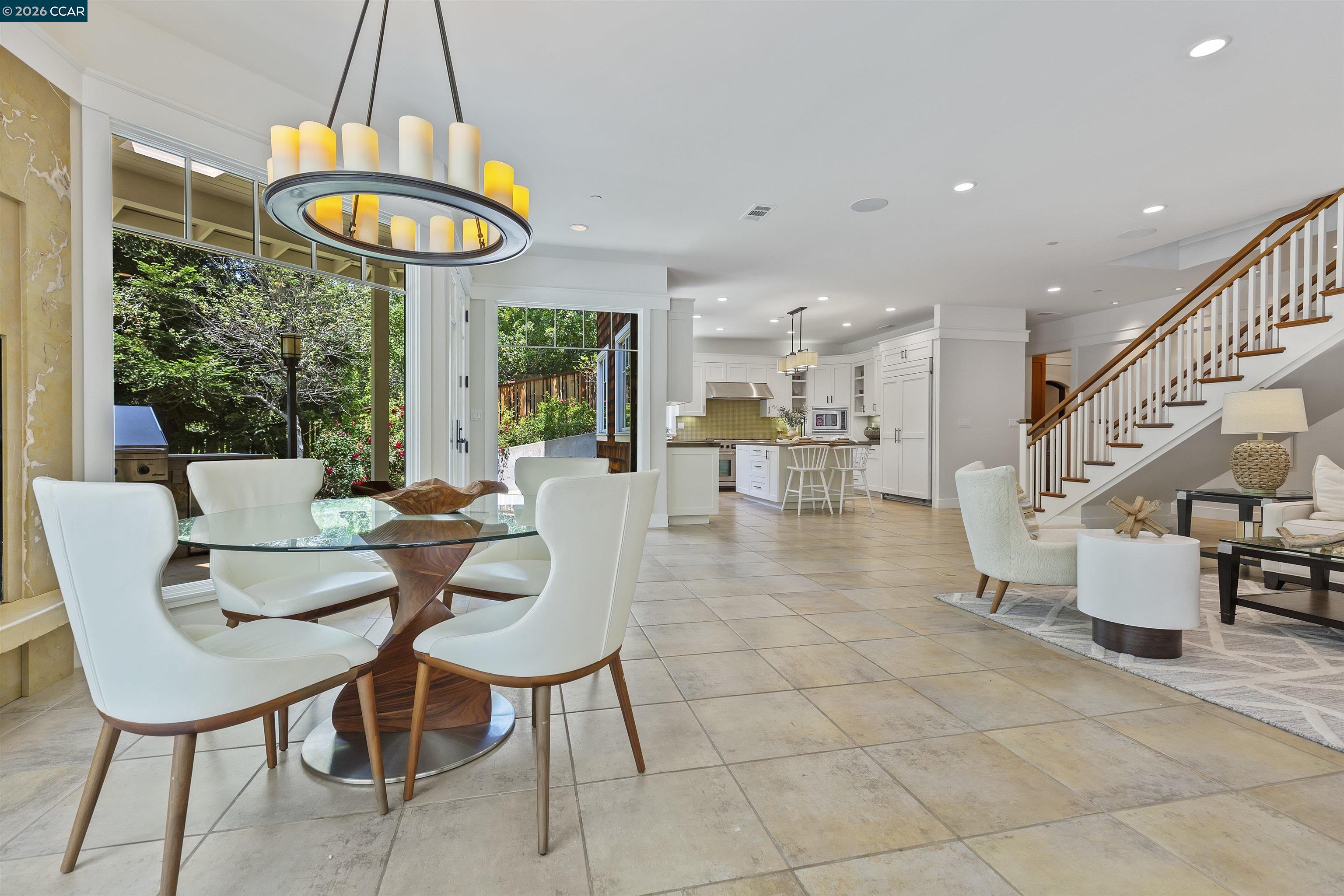 1754 Reliez Valley Road Lafayette, CA 94549 - Photo 1 of 60 a view of a dining room with furniture a chandelier and a large window