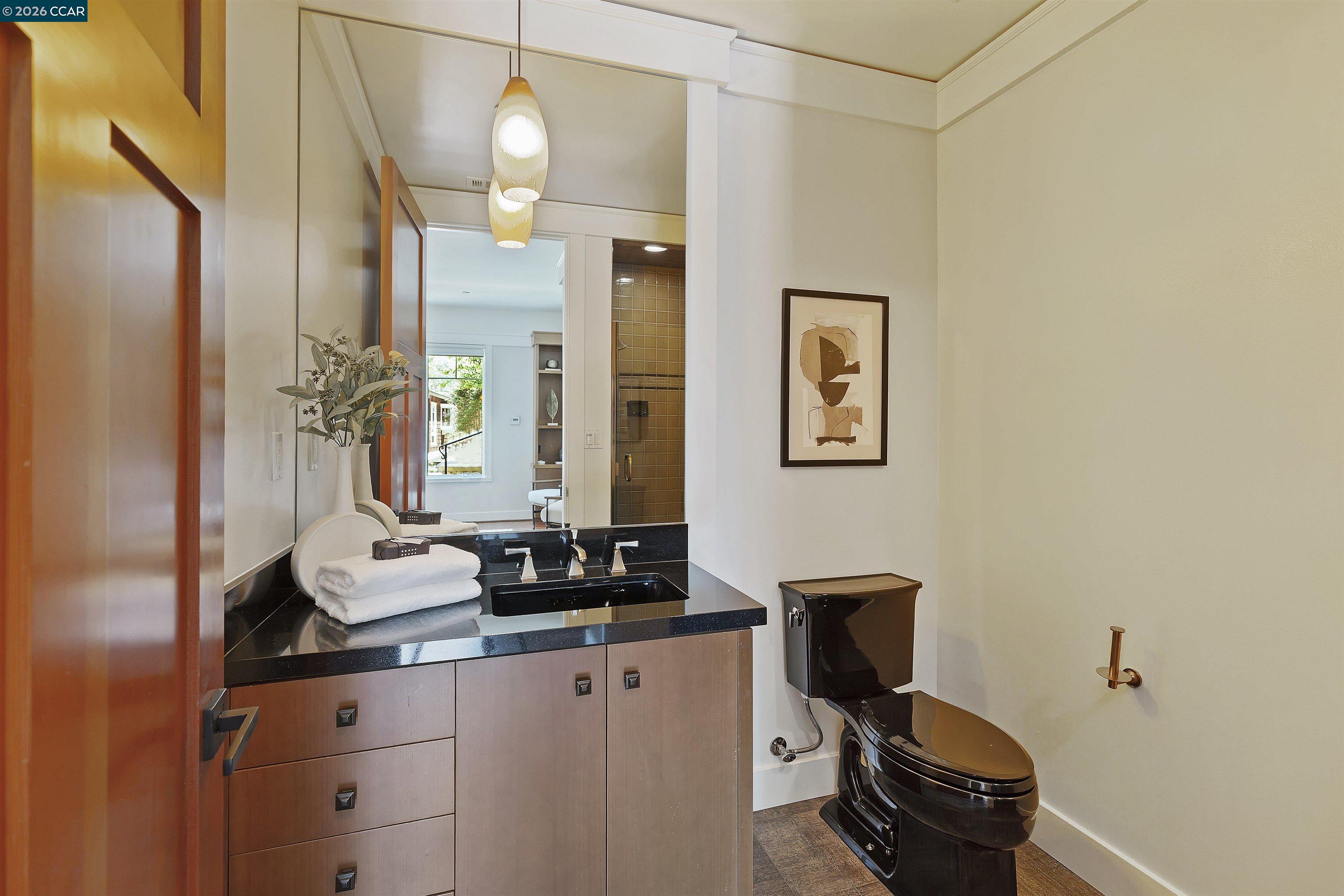 1754 Reliez Valley Road Lafayette, CA 94549 - Photo 11 of 60 a bathroom with a sink and a mirror with window