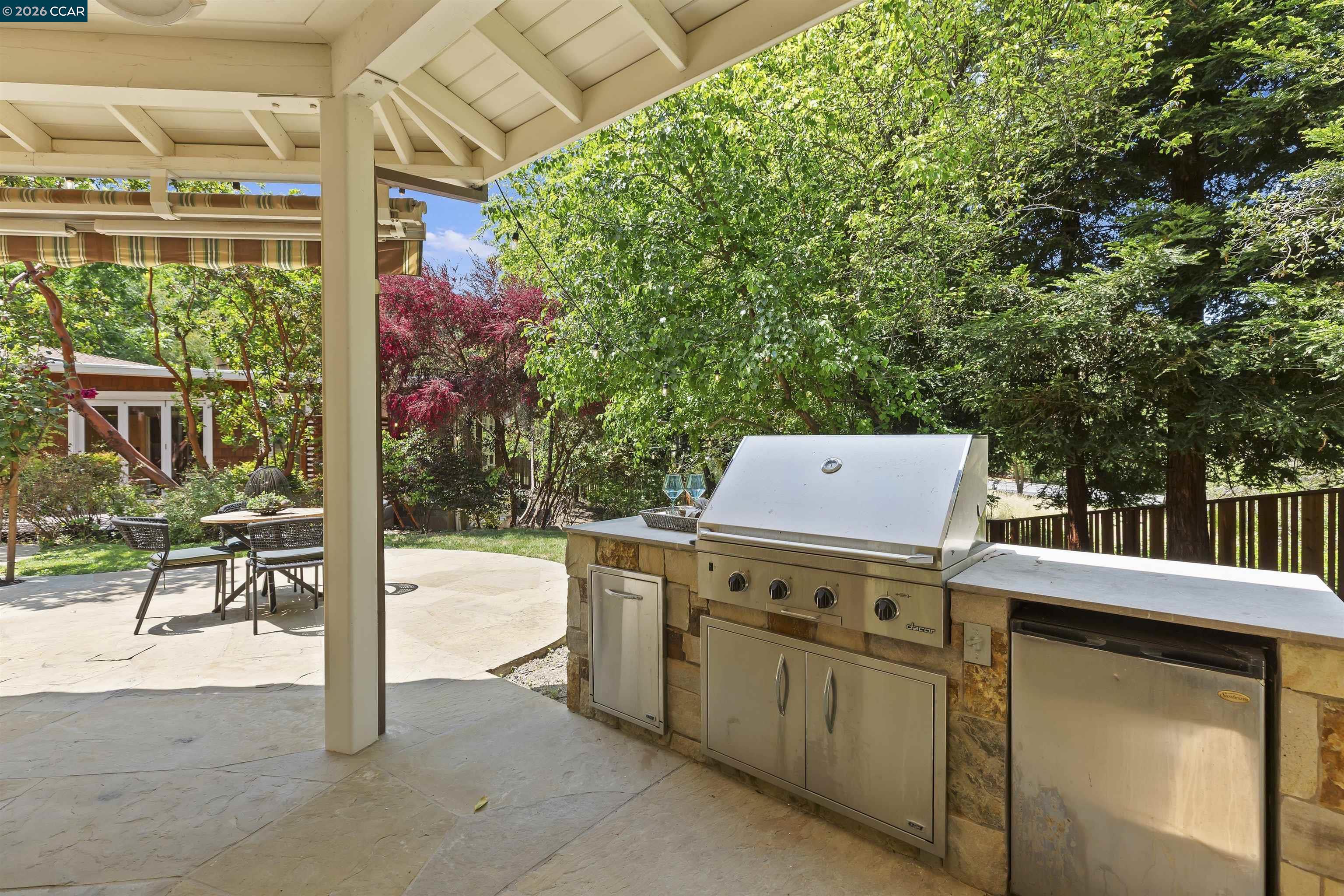 1754 Reliez Valley Road Lafayette, CA 94549 - Photo 16 of 60 a view of a patio with a table and chairs and potted plants