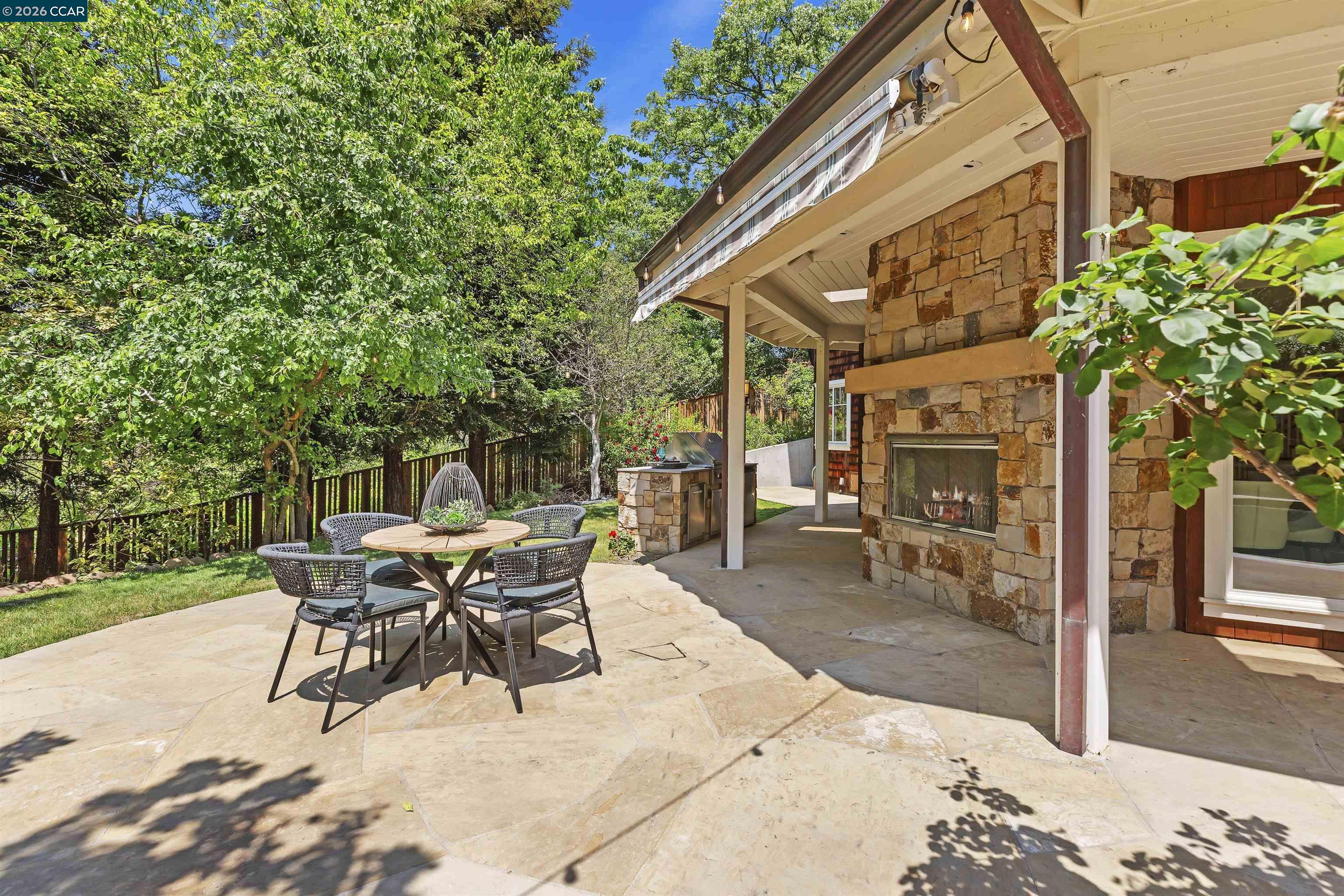 1754 Reliez Valley Road Lafayette, CA 94549 - Photo 17 of 60 a view of a patio with a table and chairs and potted plants