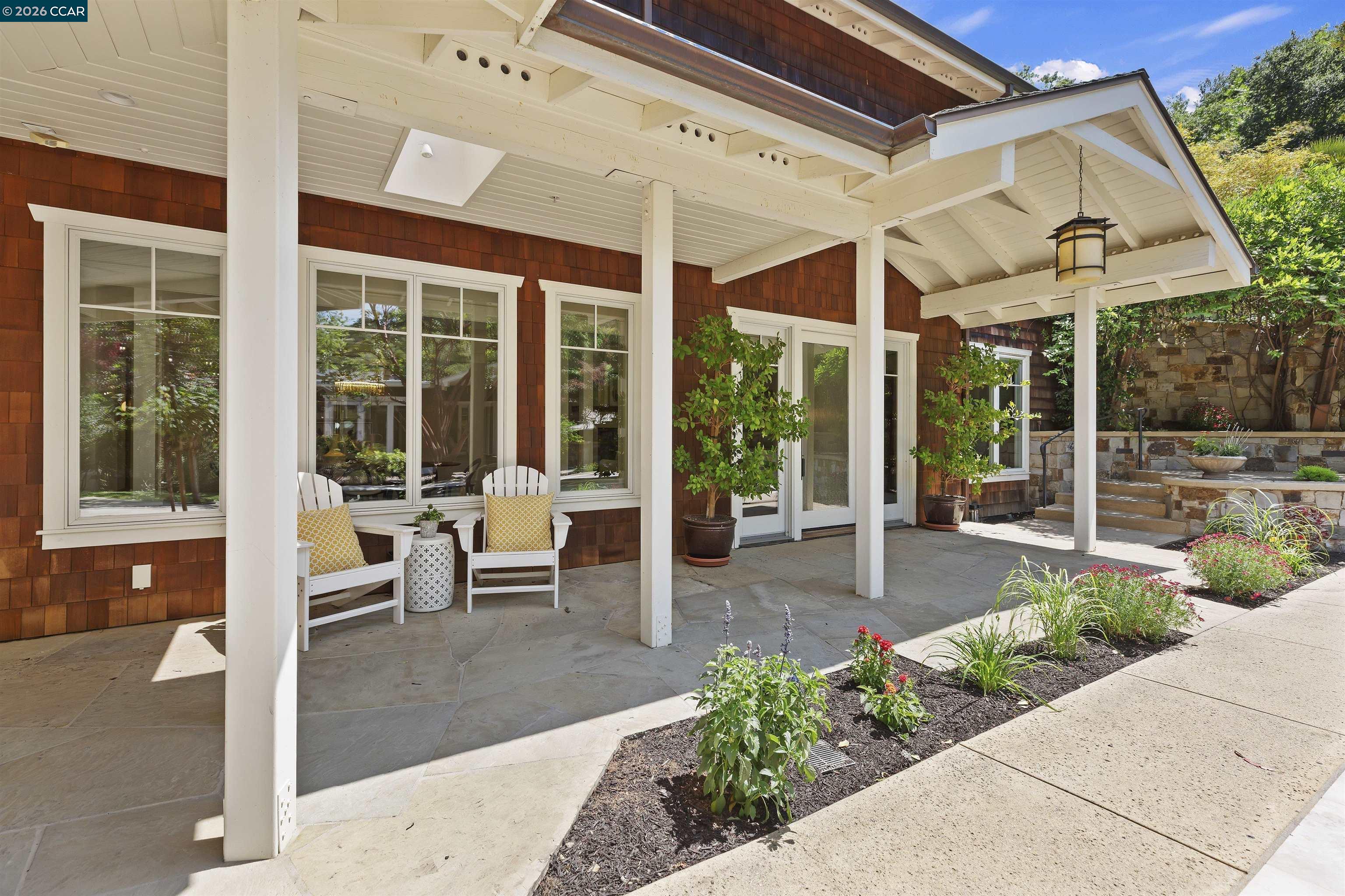 1754 Reliez Valley Road Lafayette, CA 94549 - Photo 18 of 60 a view of a patio with a table and chairs and potted plants