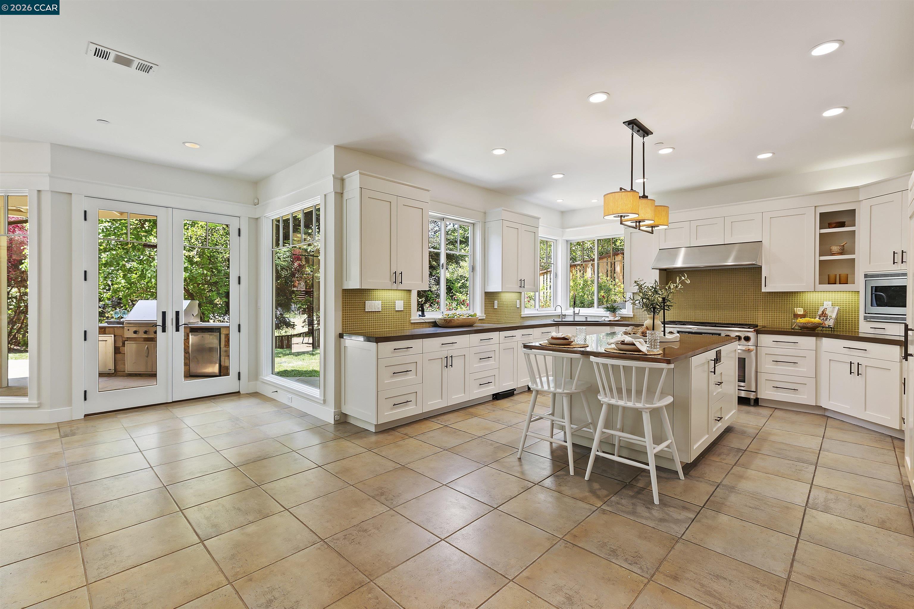 1754 Reliez Valley Road Lafayette, CA 94549 - Photo 2 of 60 a kitchen with a sink and chairs
