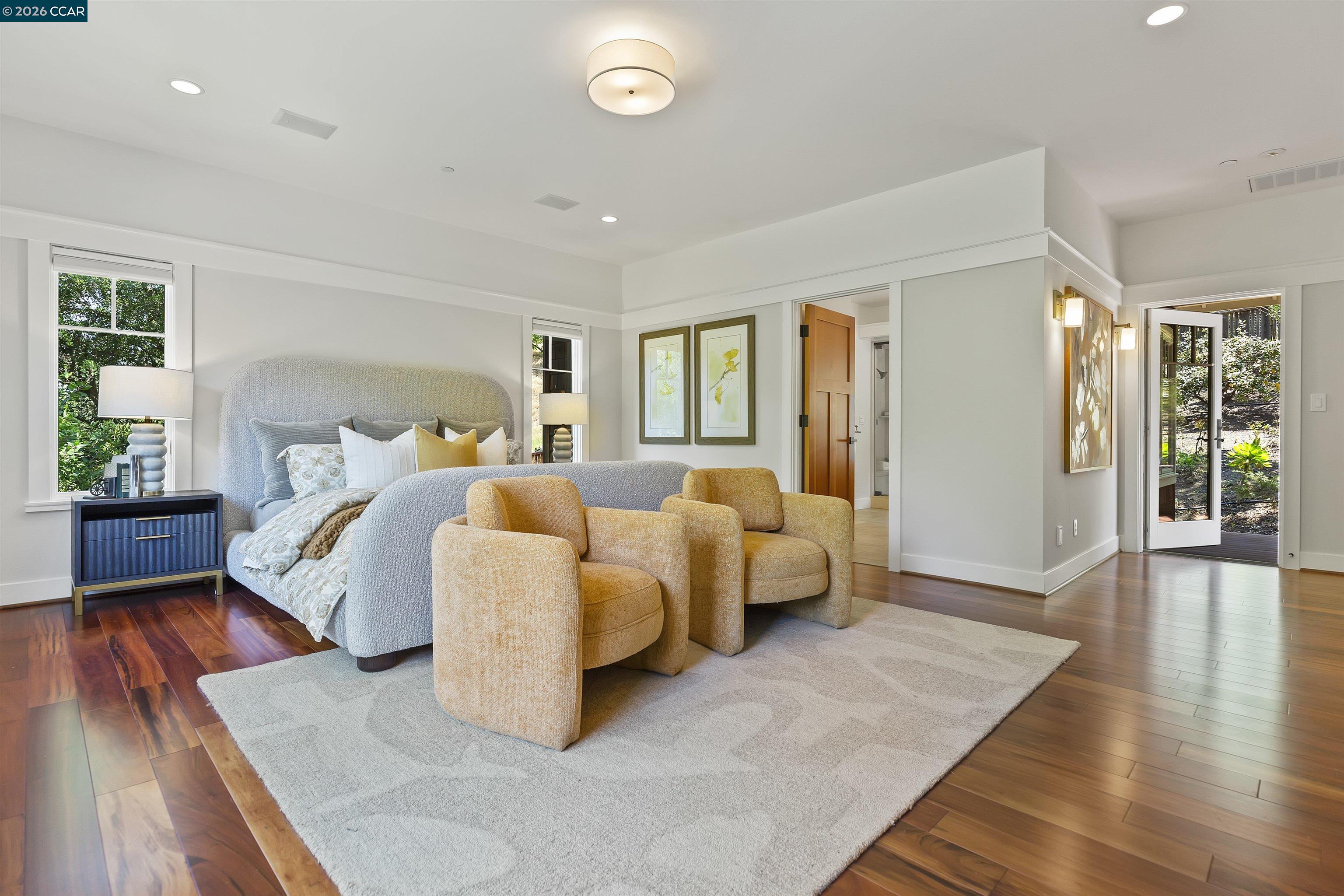 1754 Reliez Valley Road Lafayette, CA 94549 - Photo 24 of 60 a spacious bedroom with a bed and wooden floor