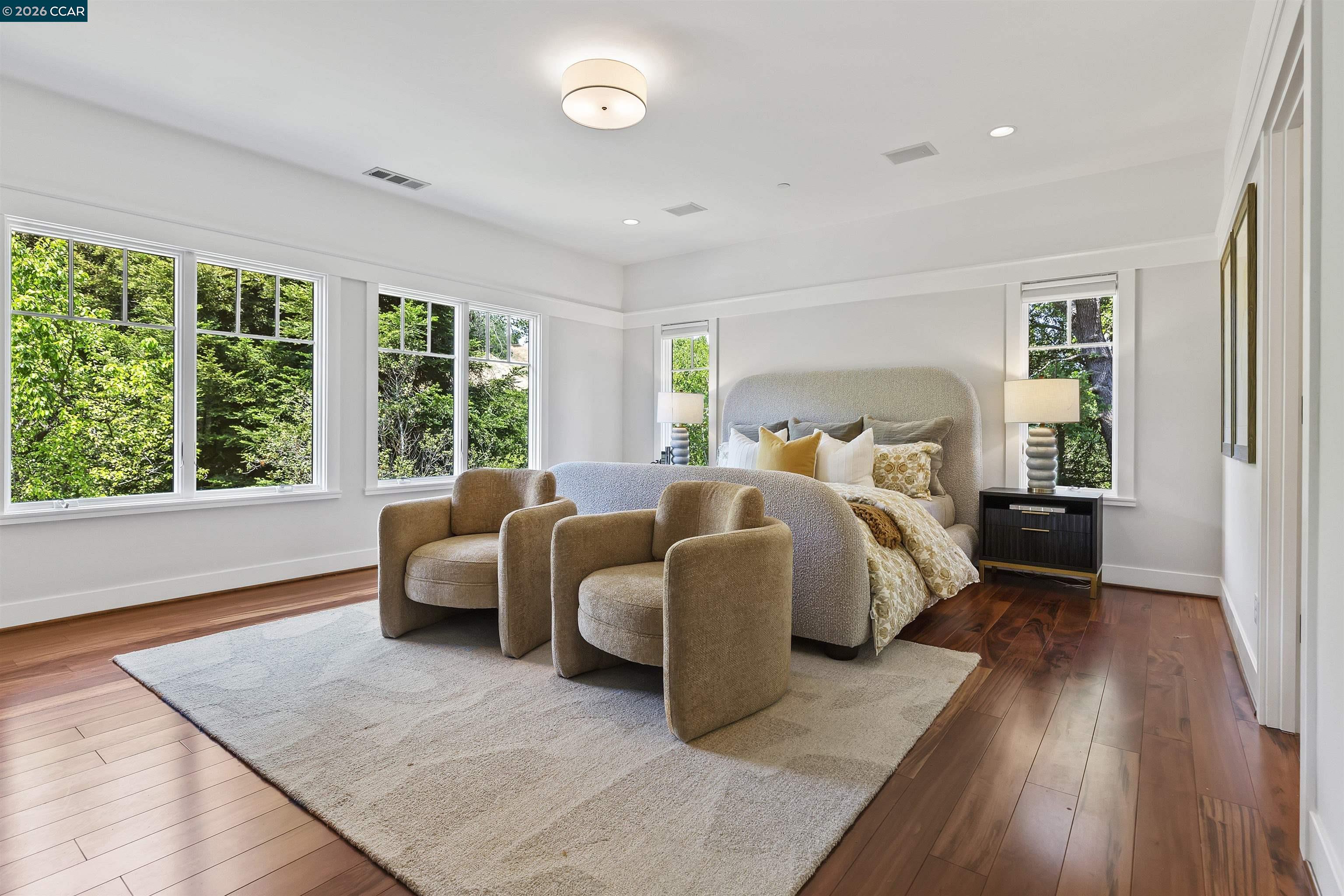 1754 Reliez Valley Road Lafayette, CA 94549 - Photo 25 of 60 a spacious bedroom with two beds and wooden floor