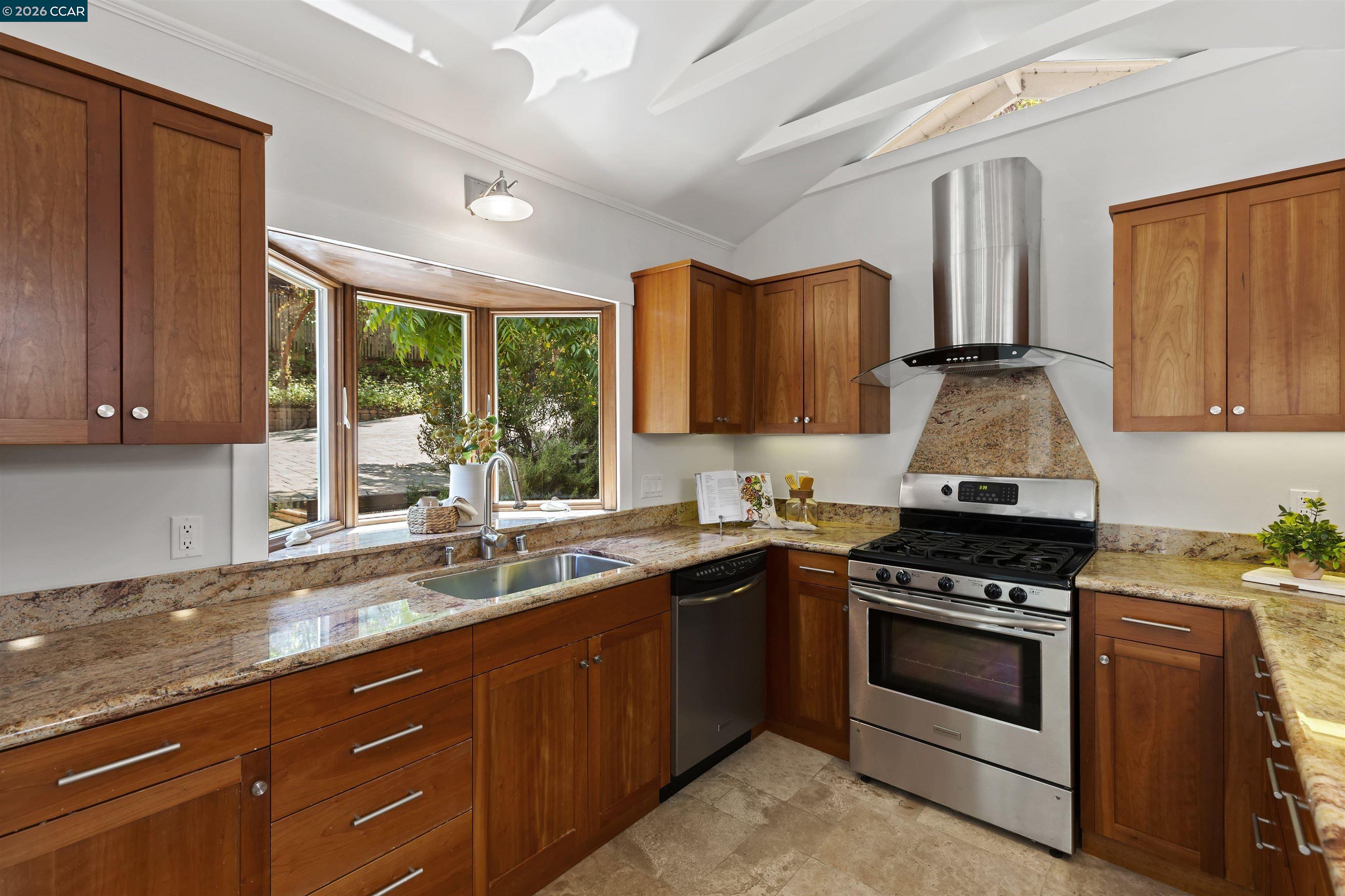 1754 Reliez Valley Road Lafayette, CA 94549 - Photo 37 of 60 a kitchen with granite countertop a stove top oven sink and cabinets