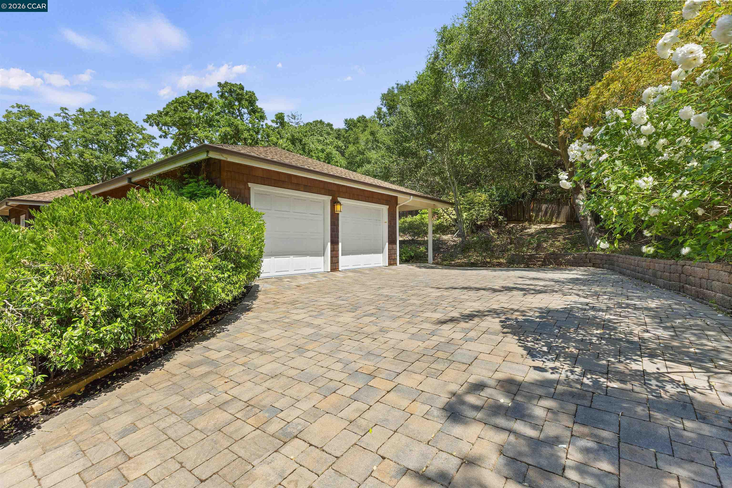 1754 Reliez Valley Road Lafayette, CA 94549 - Photo 50 of 60 a front view of a house with a yard and potted plants