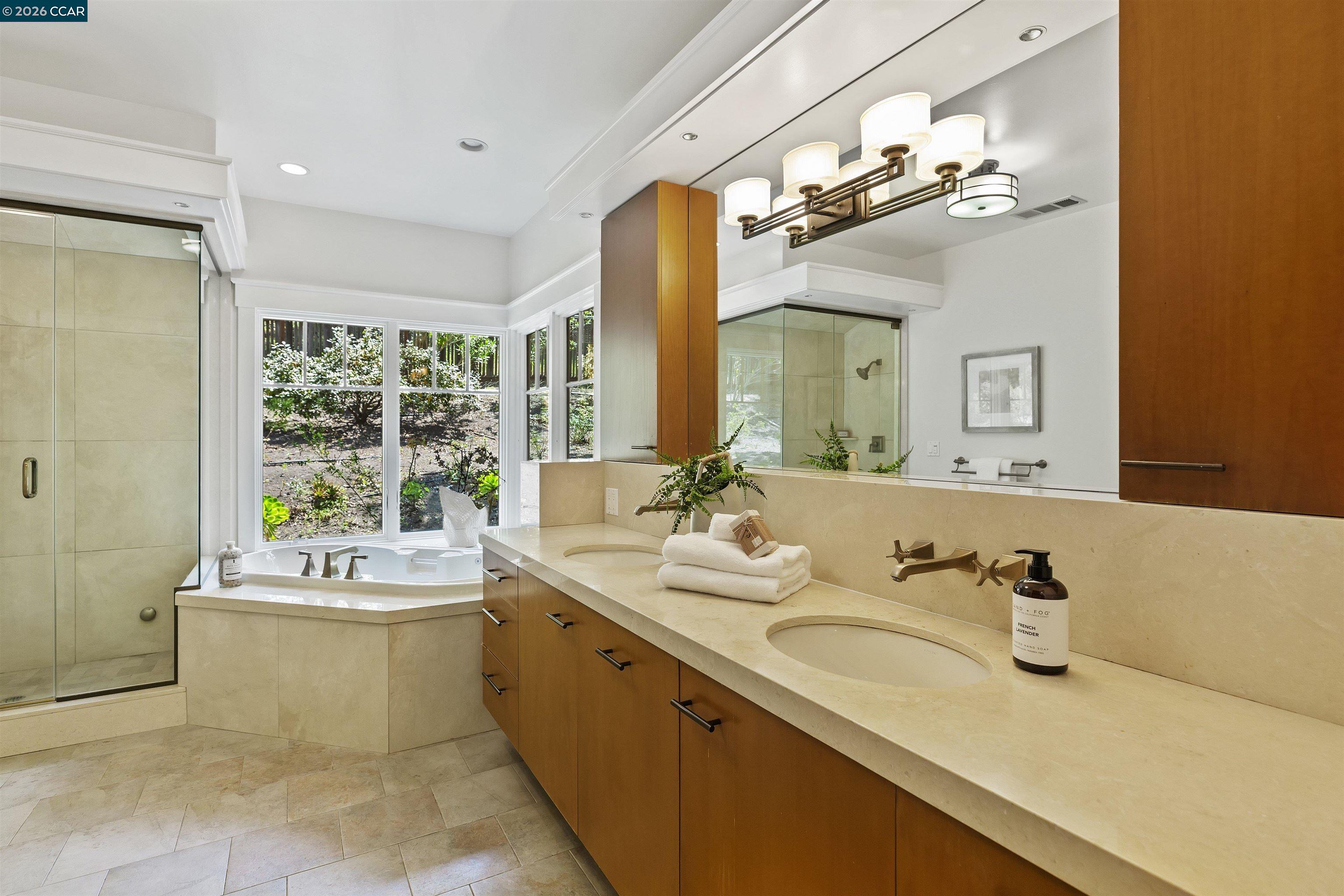 1754 Reliez Valley Road Lafayette, CA 94549 - Photo 51 of 60 a bathroom with a sink double vanity mirror and a bathtub
