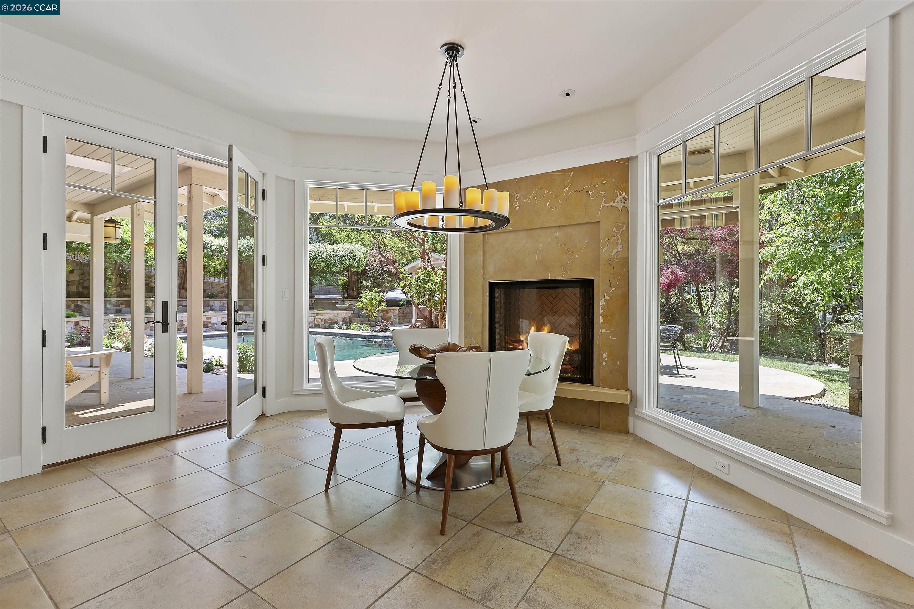 1754 Reliez Valley Road Lafayette, CA 94549 - Photo 6 of 60 a dining room with furniture a chandelier and fireplace