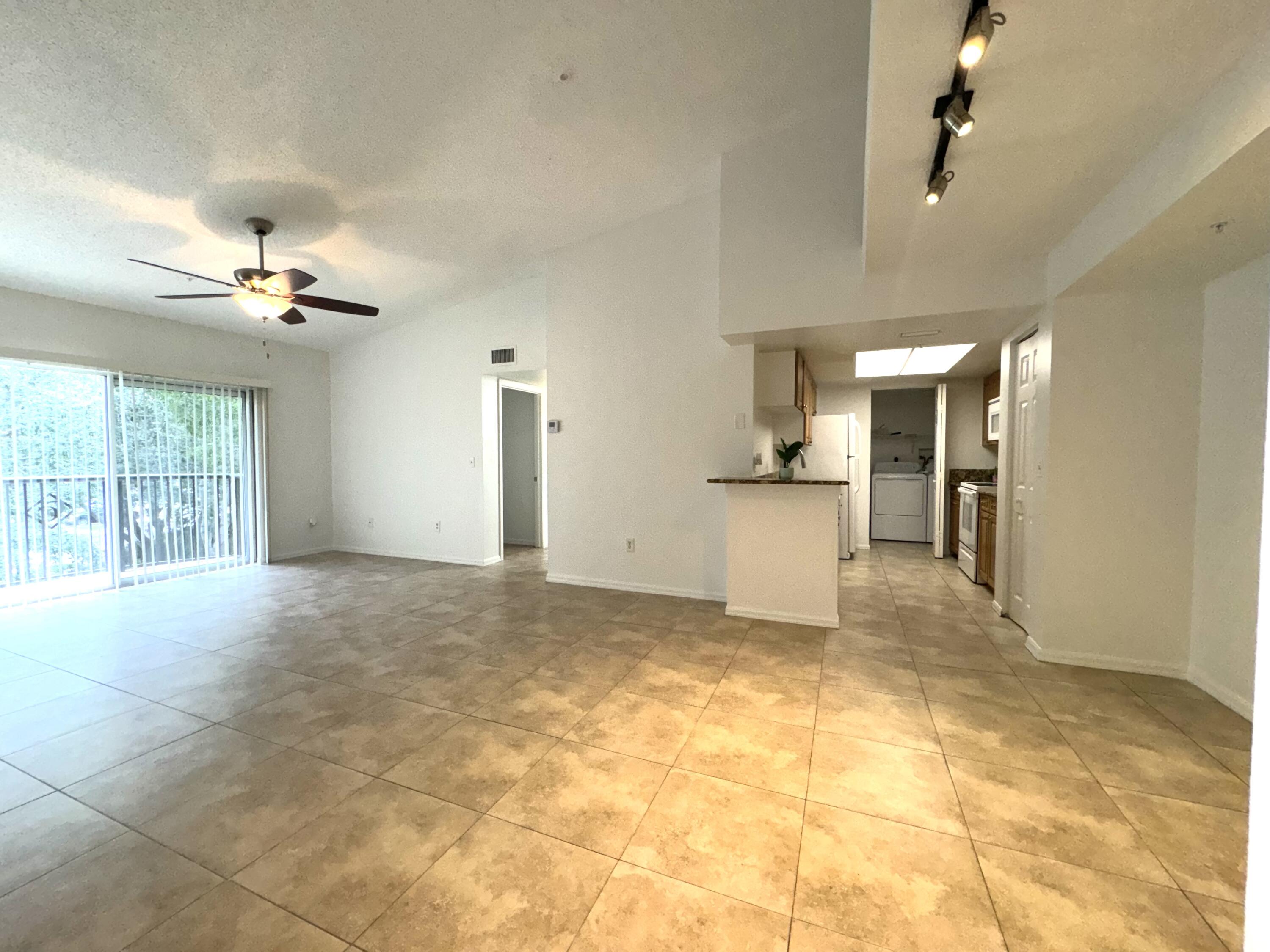 1300 Crestwood Court South, Unit 1319 Royal Palm Beach, FL 33411 - Photo 2 of 14 a view of a kitchen with a sink and cabinets
