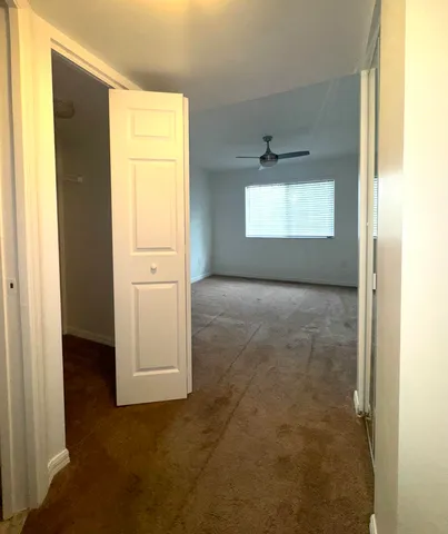 a view of an empty room with a window