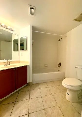 a bathroom with a bathtub and a toilet