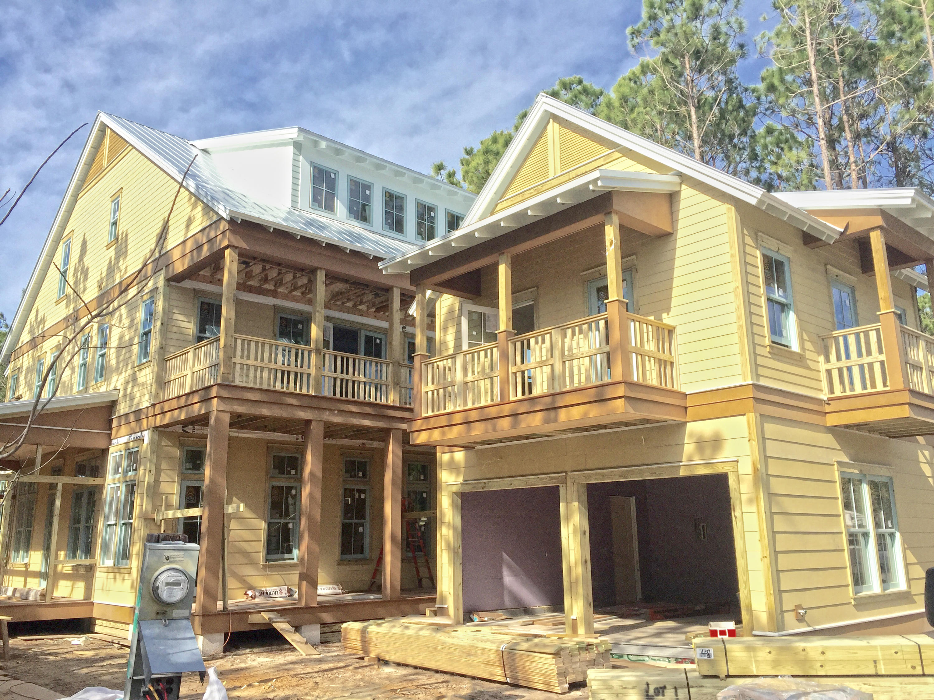 a front view of a residential apartment building with a yard