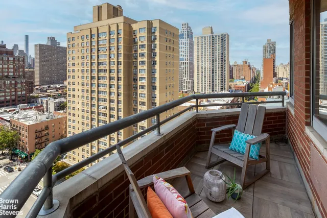 a view of balcony with furniture