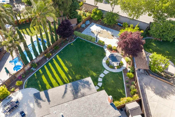an aerial view of a house having swimming pool garden and patio