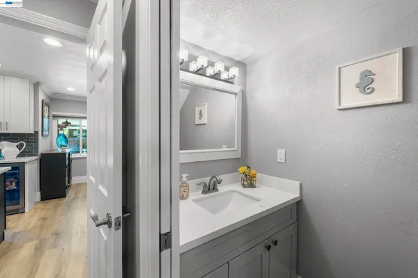 a en suite bathroom with a sink double vanity and a mirror