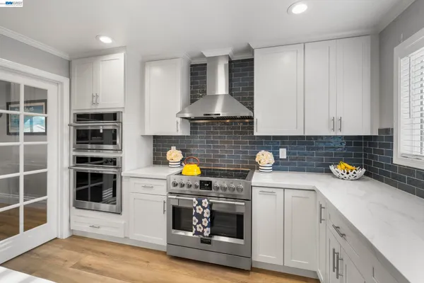 a kitchen with a cabinets and appliances