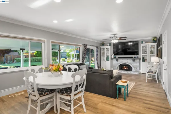 a view of a dining room with furniture window and wooden floor