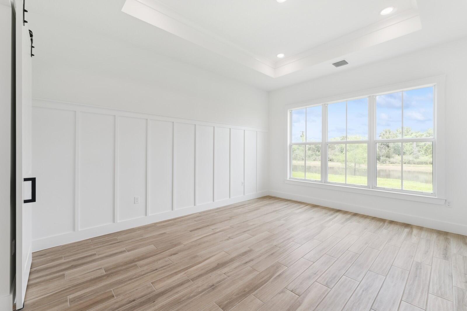 6750 Southeast Pine Drive, Unit 19 Stuart, FL 34997 - Photo 26 of 55 Primary Suite with Feature Wall