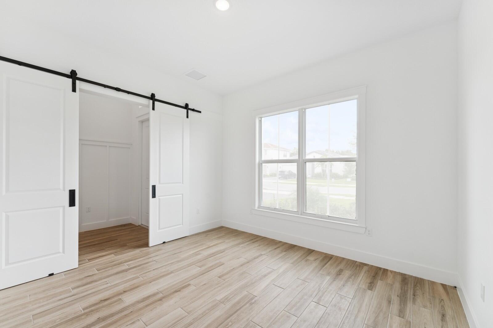 6750 Southeast Pine Drive, Unit 19 Stuart, FL 34997 - Photo 8 of 55 Home Office with Barn Doors