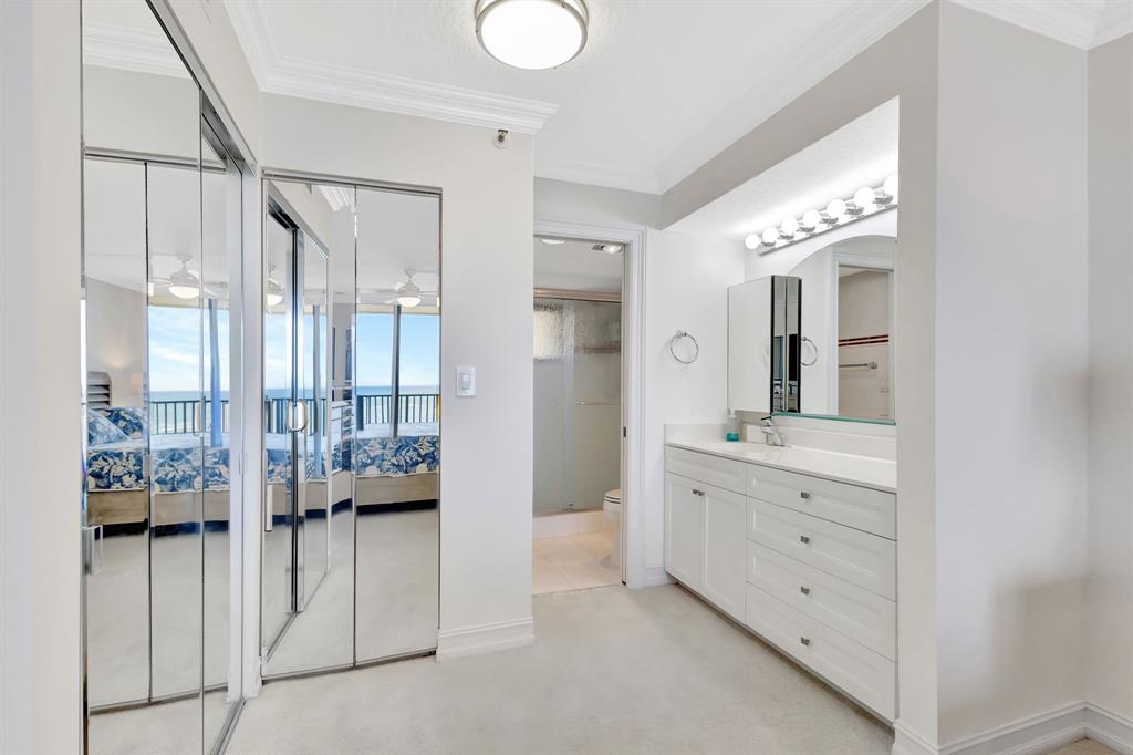 300 Ocean Trail Way, Unit 907 Jupiter, FL 33477 - Photo 17 of 42 a spacious bathroom with a double vanity sink and a mirror