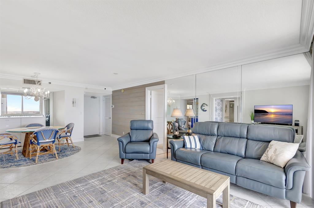 300 Ocean Trail Way, Unit 907 Jupiter, FL 33477 - Photo 25 of 42 a living room with furniture and wooden floor