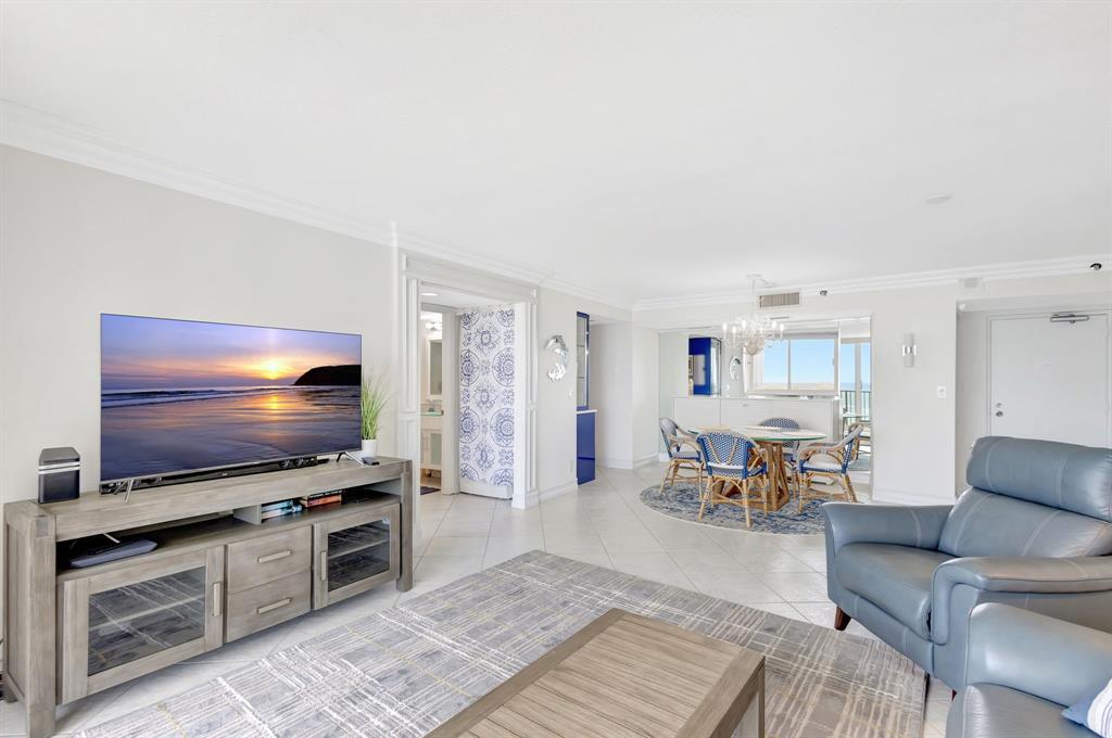 300 Ocean Trail Way, Unit 907 Jupiter, FL 33477 - Photo 26 of 42 a living room with furniture and a flat screen tv