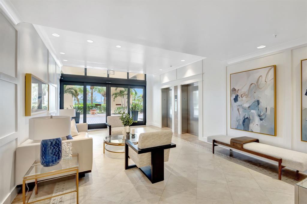 300 Ocean Trail Way, Unit 907 Jupiter, FL 33477 - Photo 34 of 42 a living room with furniture and a large window